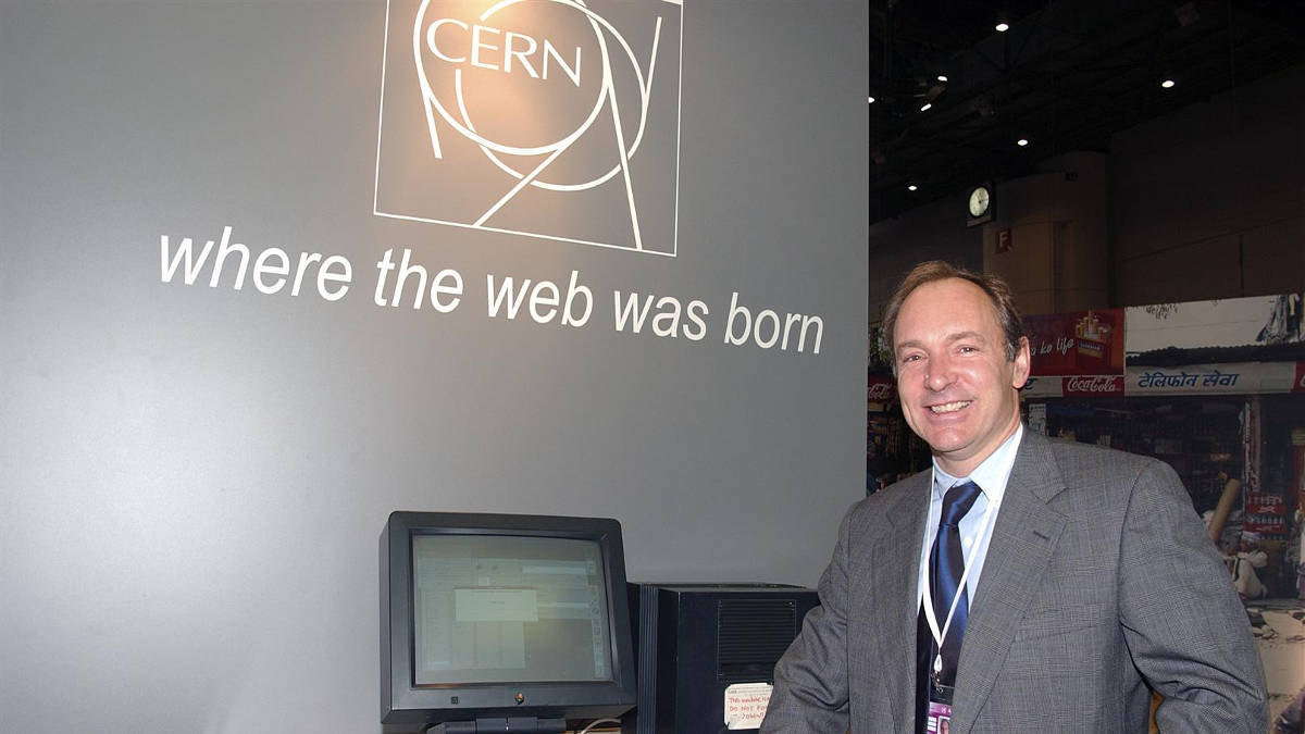Tim Berners-Lee stands in front of the first web server